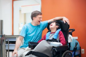 Father taking care of a child with special needs