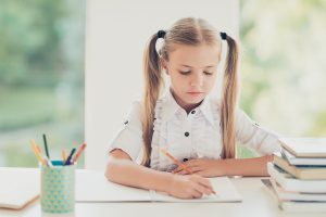 Young girl writing